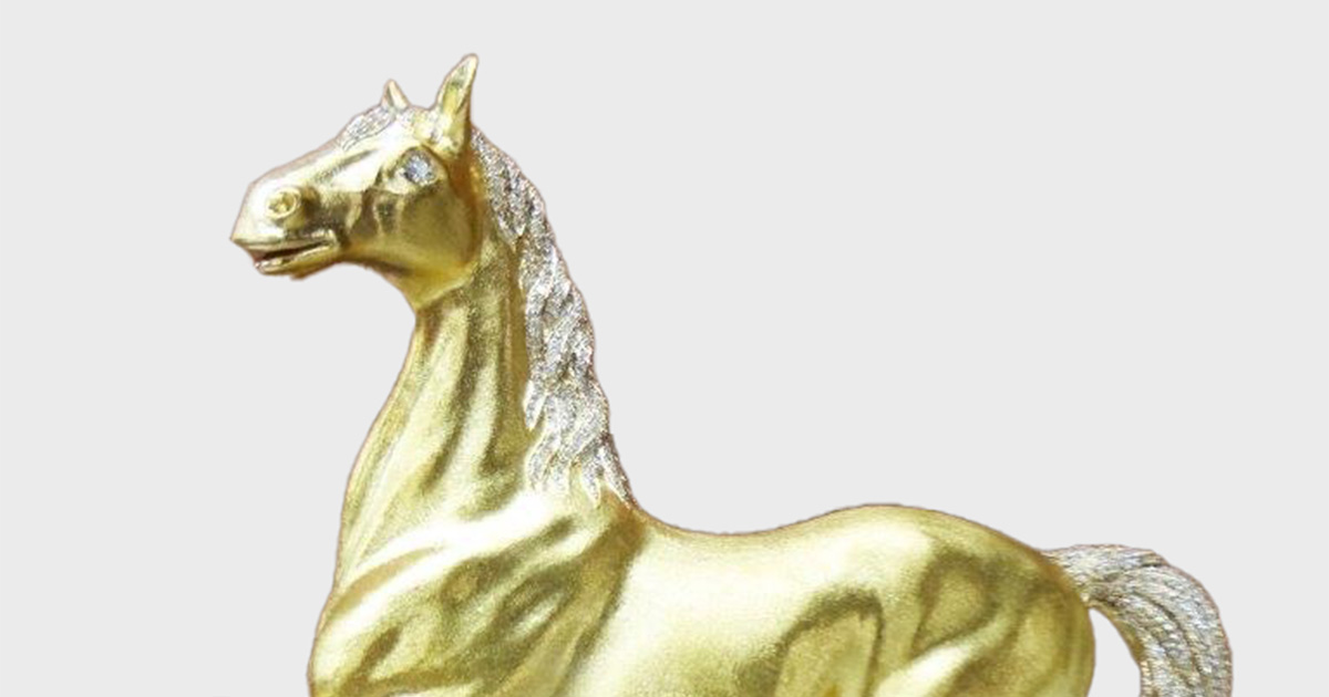 Gold horse figurine JP ON JP & ASSOCIATES
